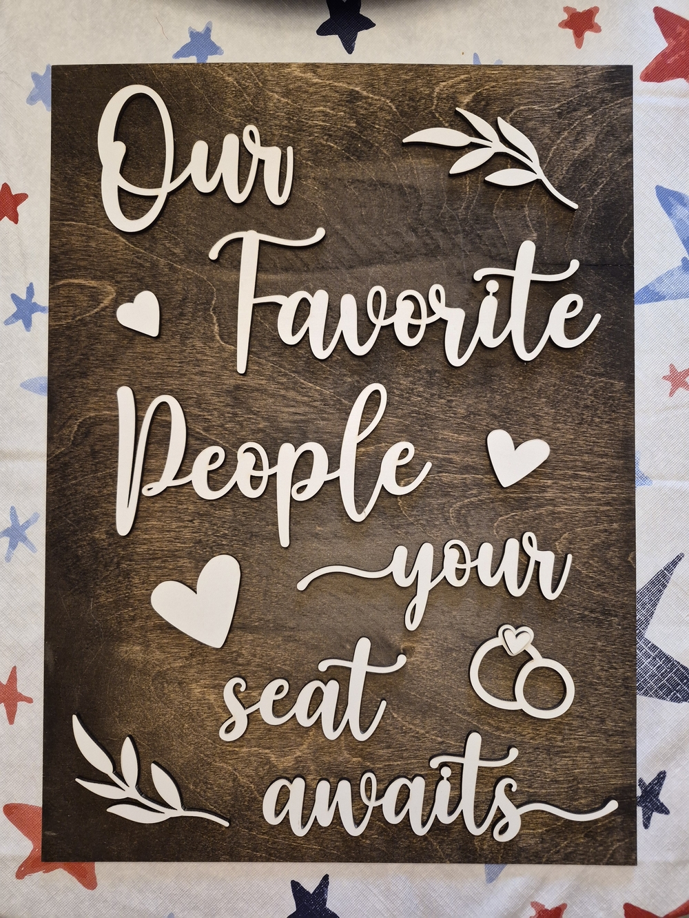Wooden 'Our Favorite People Your Seat Awaits' Wall Sign - White on Dark Wood